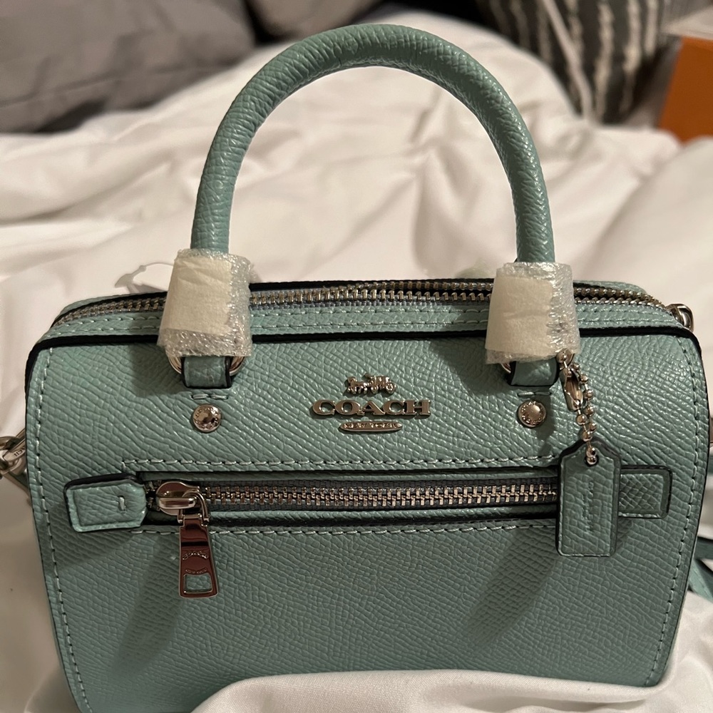 Mini coach purse that I bought on here. I thought it was larger. It’s adorable.